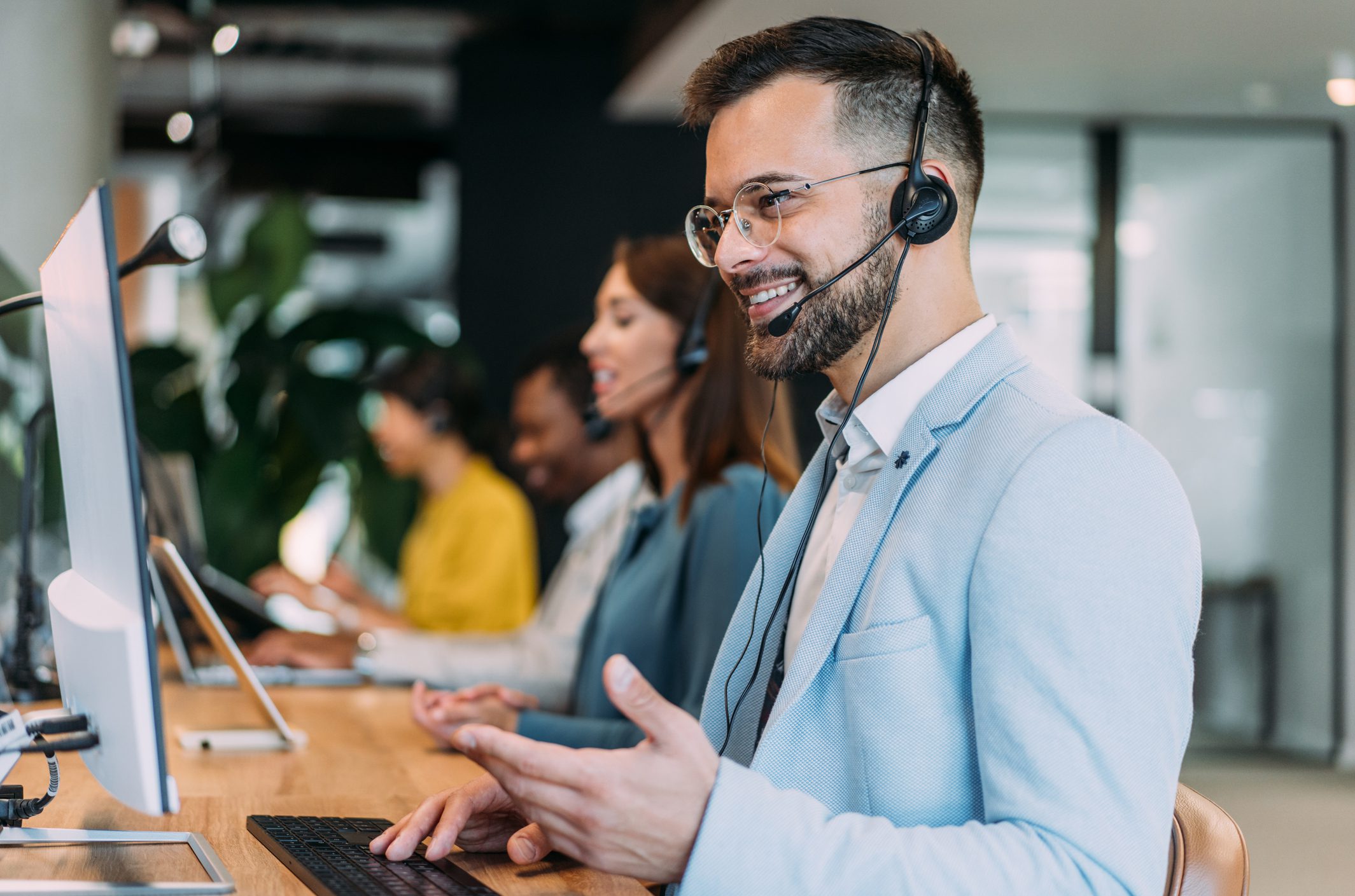 Call center team working at desks