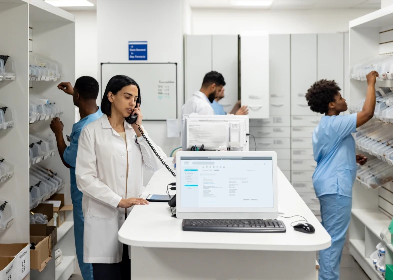 Pharmacist on phone at counter