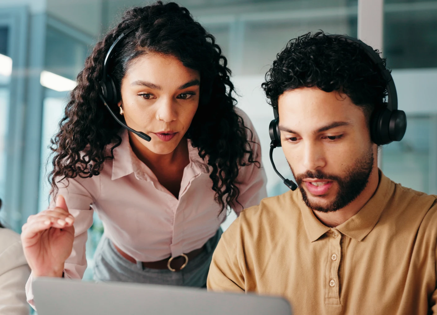 Colleagues collaborating on a laptop