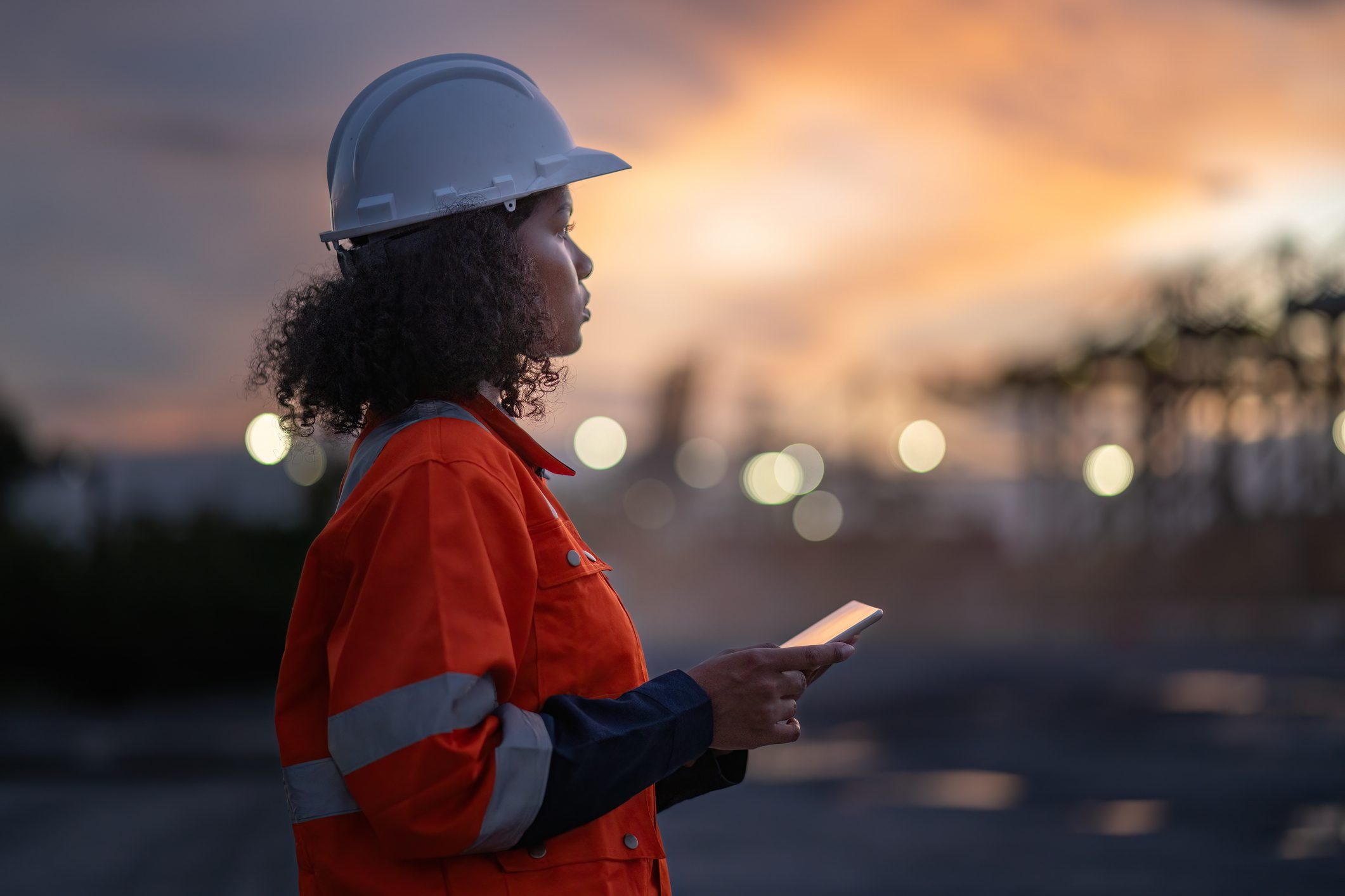 Industrial engineer operations marine port cranes loading and unloading of cargo ships global trade and supply chain import export environment monitoring responsible global economy.